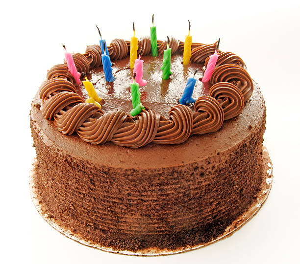 Birthday chocolate cake with colorful candles stock photo