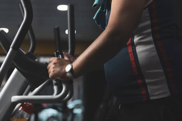istock a funny chubby young man training inside a gym.concept of effort and improvement. 1352003783