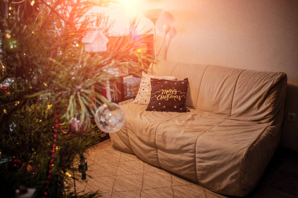 istock Apartment decorated with Christmas pillows. Cozy festive background. 1352004105