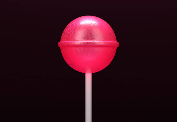 Pink lollipop on stick on black background