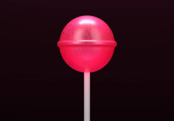 Pink lollipop on stick on black background Pink lollipop on stick on black background lolipop stock pictures, royalty-free photos & images