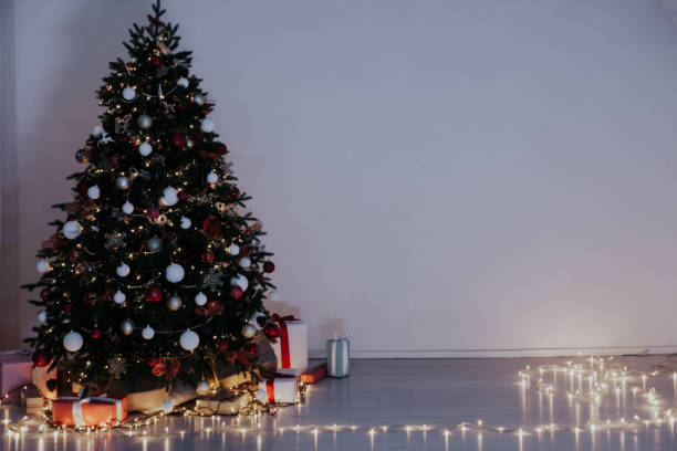 istock Christmas tree lights light garlands new year's eve presents 1352004200