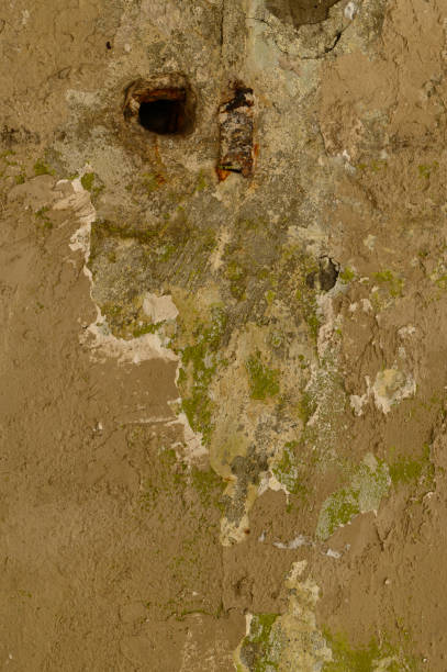 istock an old concrete wall with a hole. texture close-up 1352006126