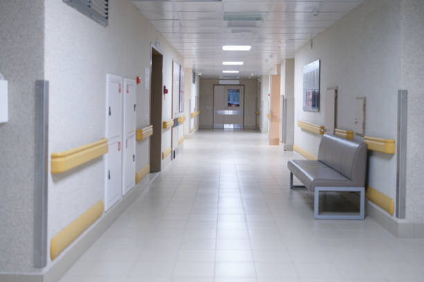 istock Empty building corridor, bright hall of the clinic 1352006551