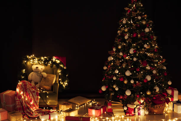 istock Christmas tree with gift lights garland decor new year 1352006587