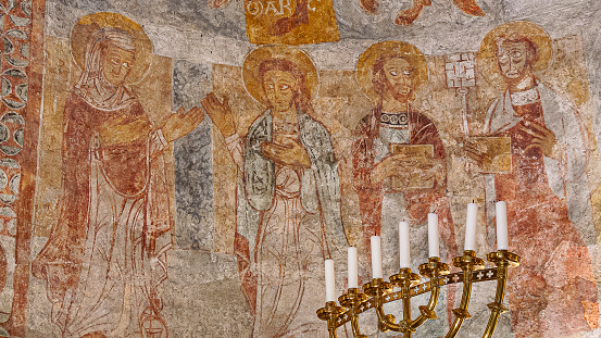 Romanesque wall-painting of Virgin Mary, st John, st Paul and st Peter with a key, Övraby church, Sweden, November 6, 2009