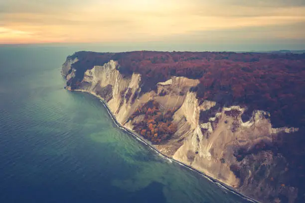 Landscape image of Møns Klint, a 6 kilometer stretch of chalk cliffs facing the Baltic Sea on the Danish island Møn (Mon Island). This nature reserve is a major tourist attraction for nature lovers, bird watchers, geologist and fossil hunters. Images are captured by drone.