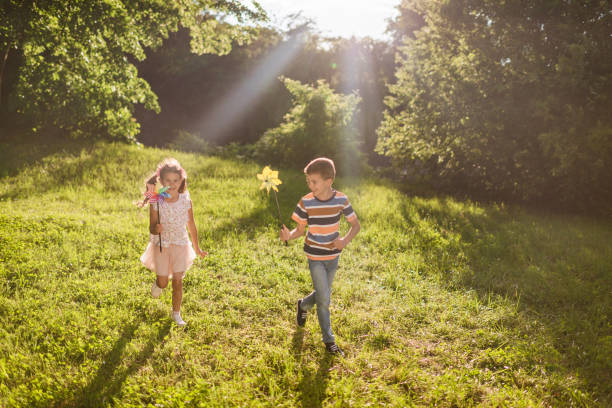 istock Beautiful children running in nature 1352009474
