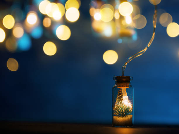 istock Christmas garland, Christmas tree in a glass jar on a blue background, copy space 1352009509