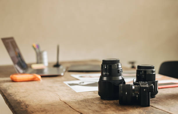 Shot of a photographer's workstation Shot of a photographer's workstation at home. Still life shot of a desk with a DSLR camera and other photographic equipment. creative space photos stock pictures, royalty-free photos & images