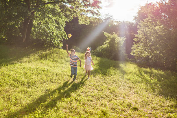 istock Beautiful children running in nature 1352009554