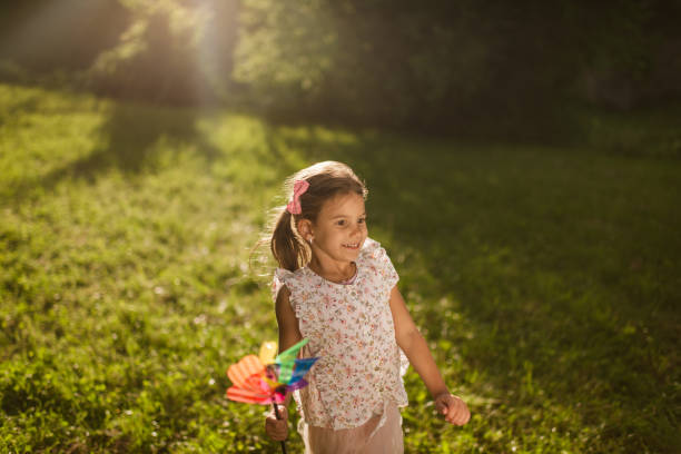istock Beautiful girl running in nature 1352009597