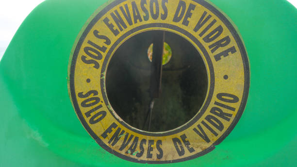 istock Entry of glass containers into recycling tank 1352010853