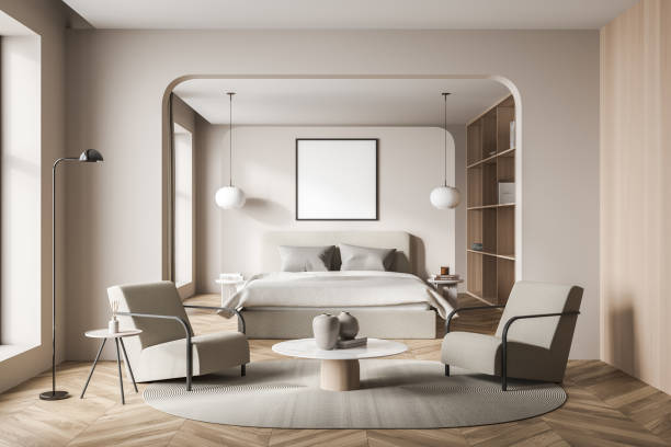 istock Beige bedroom interior with armchairs and bed on concrete floor, mockup frame 1352011423