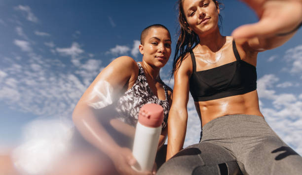 Young sportswomen taking a selfie after a workout session