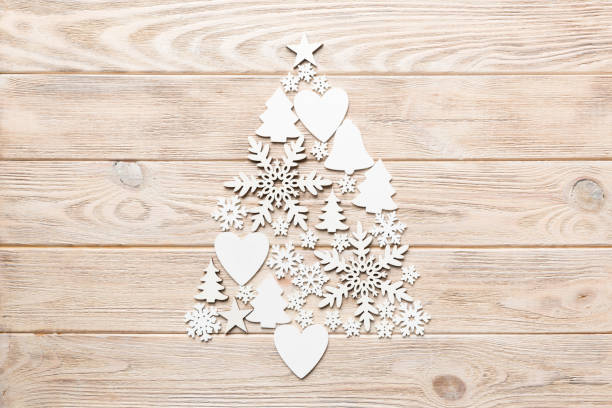 istock Christmas tree made from colored handmade ball decoration on colored background, view from above. New Year minimal concept with copy space 1352015112