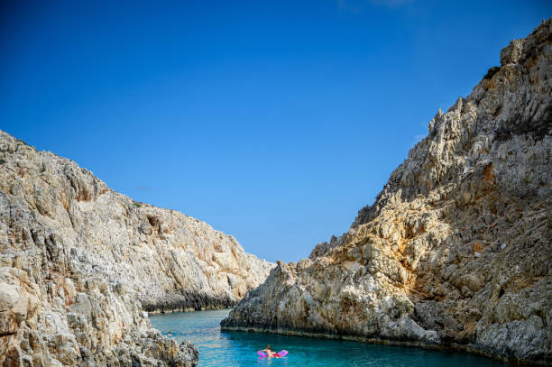 Crete, Greece: Beautiful beach, the Seitan Limania Beach, in a small secret bay in the Mediterranean on a sunny day.