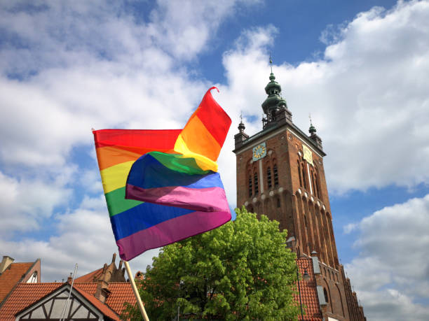 rainbow flag and catholic church stock photo