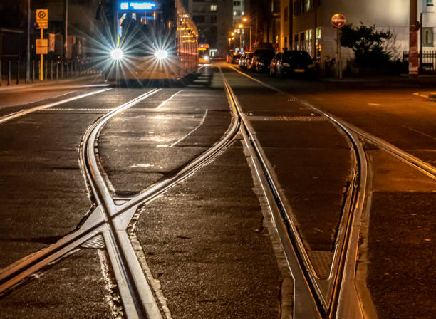 istock View Of Tam On Railroad Tracks At Night 1352022462