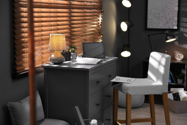 istock Stylish room interior with comfortable workplace near window 1352024236