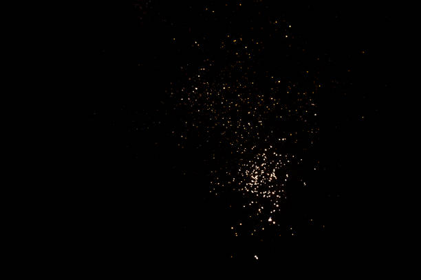 istock Golden abstract bokeh on black background. 1352025715