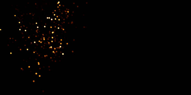 istock Golden abstract bokeh on black background. 1352025719