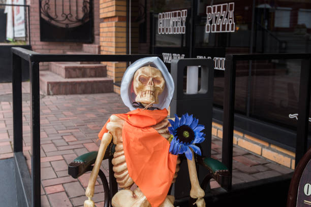 The skeleton at the cafe in the days of Halloween's celebration. stock photo