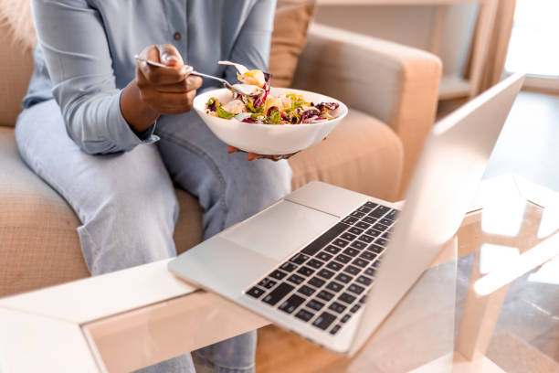 istock Woman working from home and having salad for lunch 1352026047