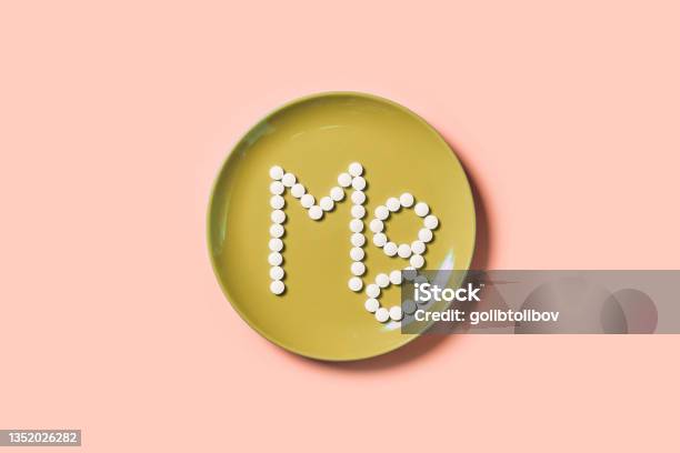 Mg Text Symbol Of Magnesium On Plate Stock Photo - Download Image Now - Magnesium, Nutritional Supplement, Pill