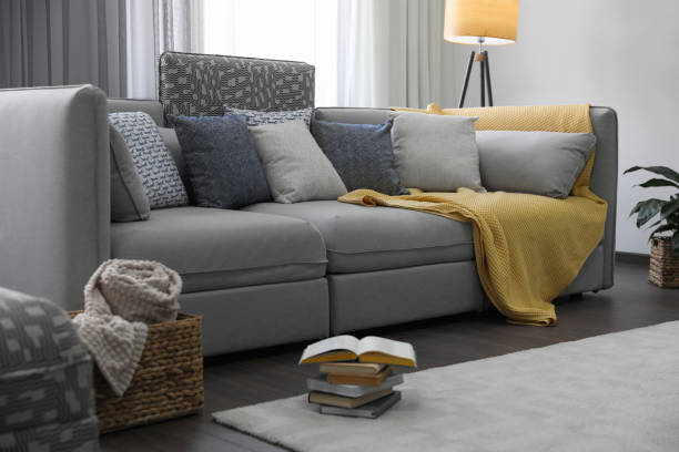 istock Elegant living room with comfortable sofa near window. Interior design 1352026673
