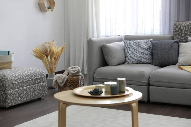 istock Elegant living room with comfortable sofa near window. Interior design 1352026689