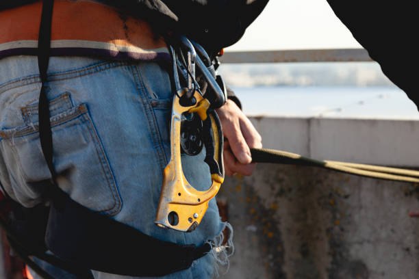 istock High-altitude work, climbing harness with carabiners 1352026781