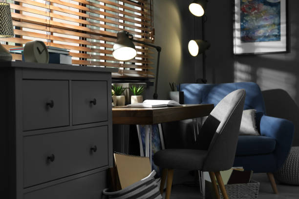 istock Stylish room interior with comfortable workplace near window 1352026923
