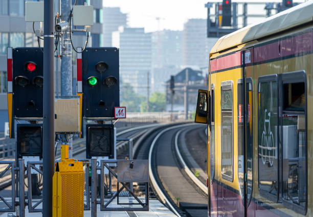 istock Train On Railroad Tracks In City 1352027065