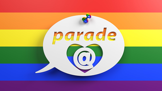 Pinned chat bubble and parade text. On LGBTQ flag. Horizontal composition with copy space. Isolated with clipping path.