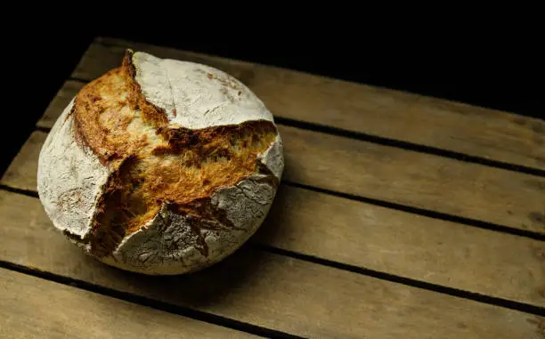 freshly baked homemade bread on an old wooden crate