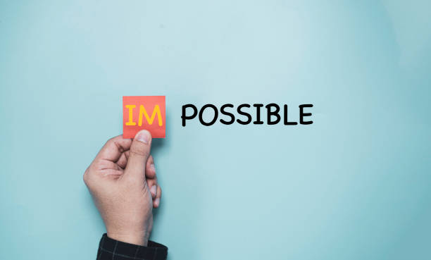 istock Hand holding red paper and IM alphabet to add for change possible to impossible, Positive thinking idea and mindset concept. 1352034207