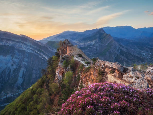 Amazing sunrise at the ancient fortress on the top of the mountain. The Gunib fortress is a historical monument of Dagestan. Russia. Amazing sunrise at the ancient fortress on the top of the mountain. The Gunib fortress is a historical monument of Dagestan. Russia. north caucasus photos stock pictures, royalty-free photos & images