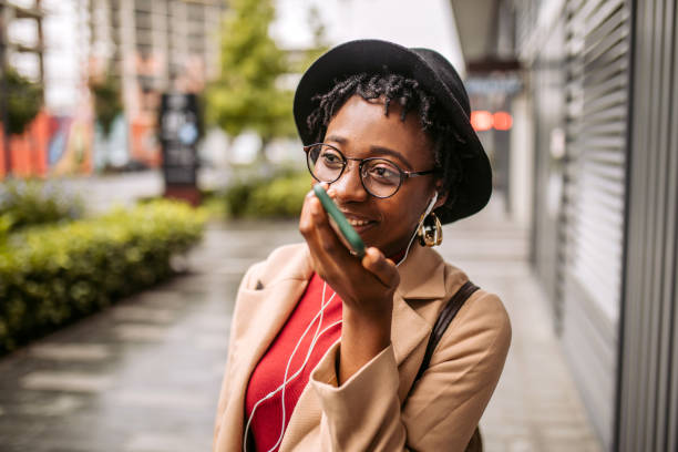 istock Woman having phone conversation on her way to the office 1352037241