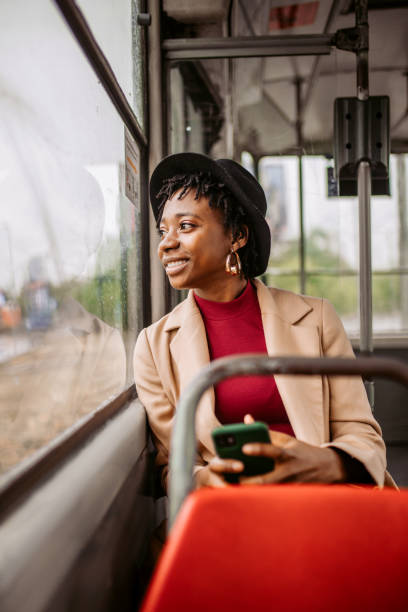 istock Young woman traveling to work by bus 1352038369