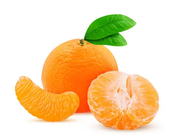 Photo of Fresh mandarin with peeled tangerine cut in half and green leaf