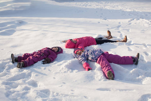 istock People Lying On Snow Covered Land 1352040565