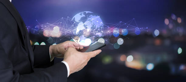 istock Businessmen use smartphones and hold virtual worlds. 1352040724