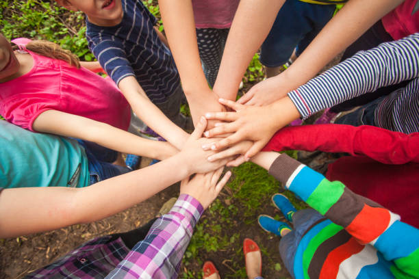 istock Low Section Of People Standing In Hands 1352040763