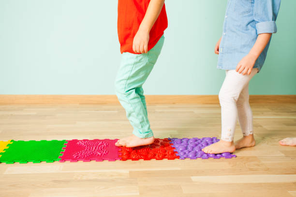 istock Low Section Of People Standing On Wooden Floor 1352040806