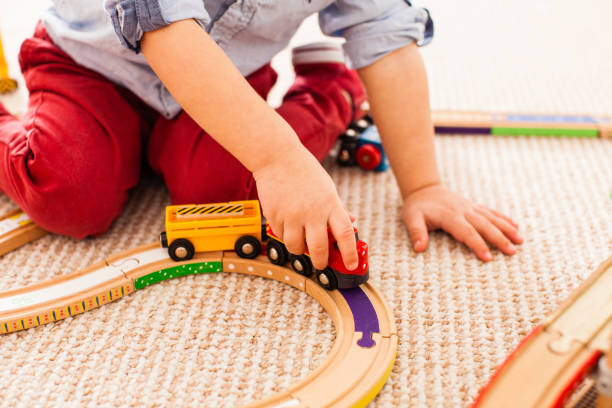 istock Rear View Of Boy Playing With Toy 1352041245