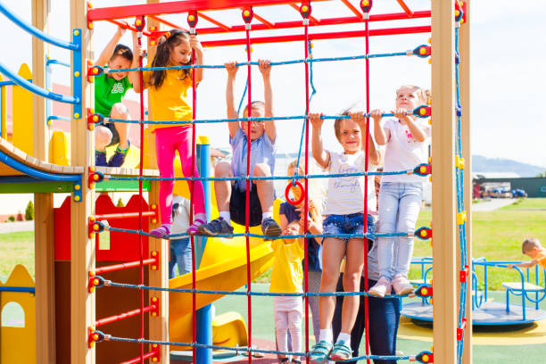 istock Group Of People In Amusement Park 1352041616