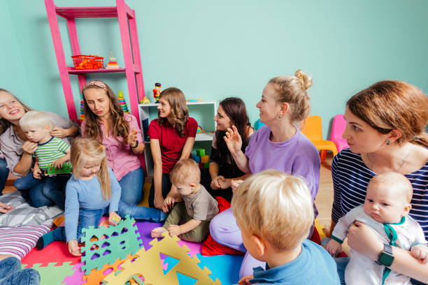 istock Rear View Of People Sitting On Floor 1352045676