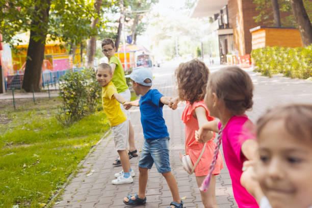 istock Rear View Of People Enjoying In Park 1352046534