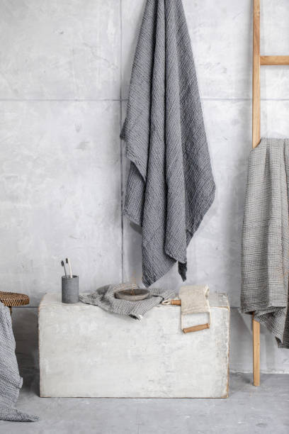 istock Organic waffle linen towels, bamboo toothbrushes, bathroom zero waste accessories in grey shades in contemporary bathroom interior. Daily body care, spa and wellness zero waste bathroom concept 1352050964